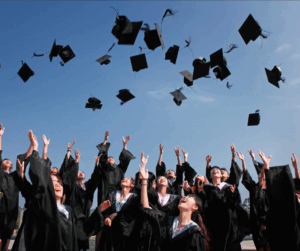 University graduates in black gowns tossing caps in the air, symbolizing the importance of FERPA compliance in protecting student privacy from enrollment to graduation.