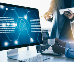 Business professionals discussing authentication strategy in front of a computer screen displaying digital padlocks and binary code.