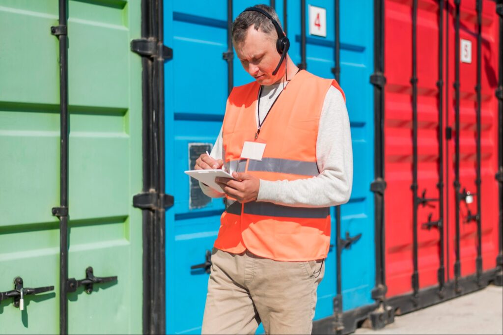 A man reviews the rules for IAM for Oil and Gas on a tablet