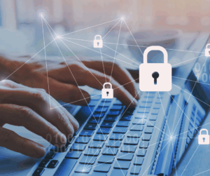 A student typing on a laptop with a lock icon overlay, showing the security of student and faculty IAM in higher education