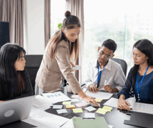 Team meeting with sticky notes and documents on the table, symbolizing brainstorming and secure planning.