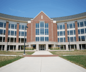 Modern brick university building symbolizing institutions that follow FERPA compliance to protect student education records.