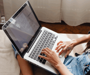 A person using a laptop to do research on identity access management platforms